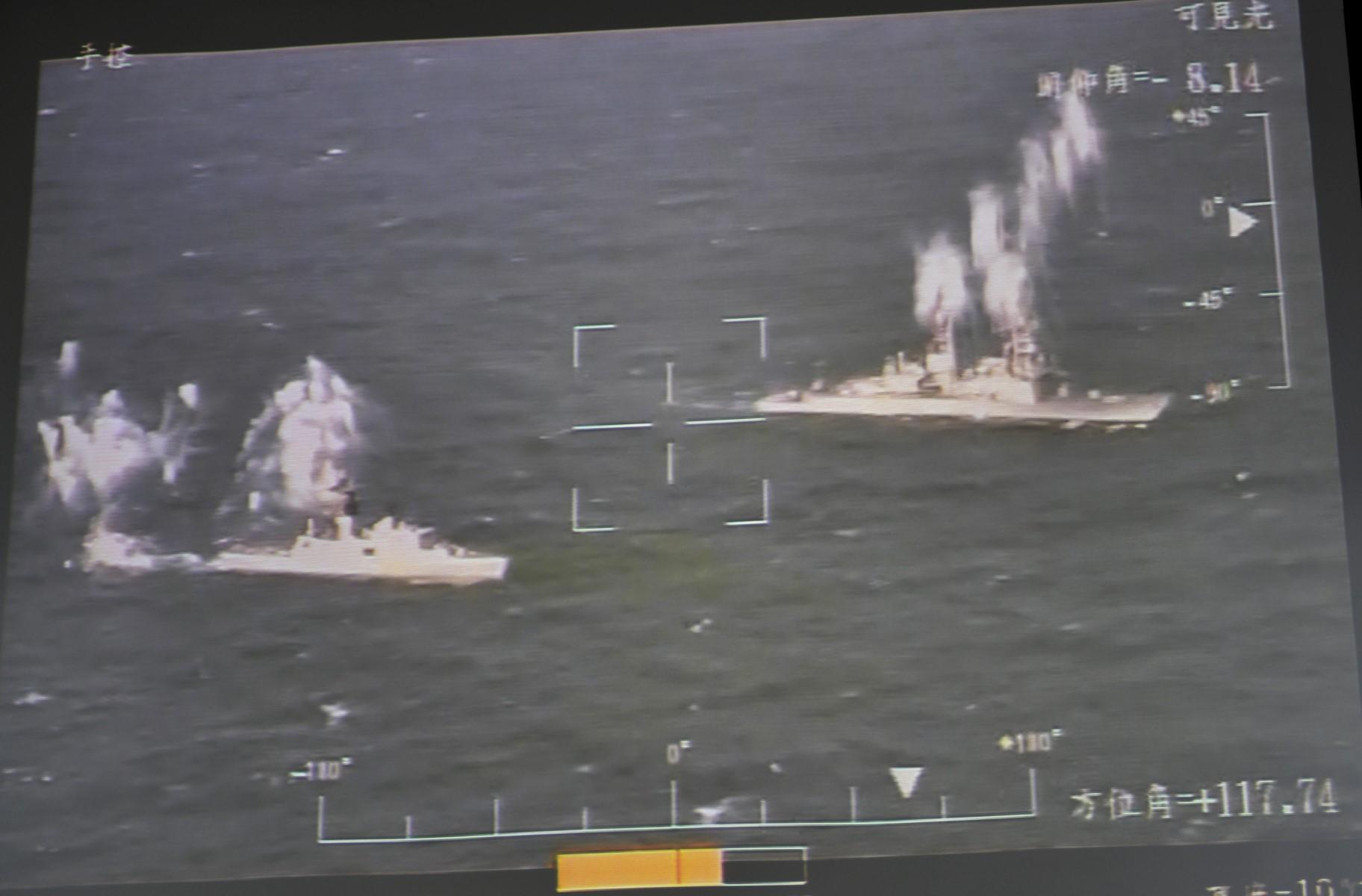 Warships launching countermeasures are seen on a screen showing a real-time feed from an indigenously-made Rui Yuan unmanned aerial vehicle (UAV), during a military exercise at the Pingtung Air Force Base in southern Taiwan on Jan 24, 2019. Photo: AFP
