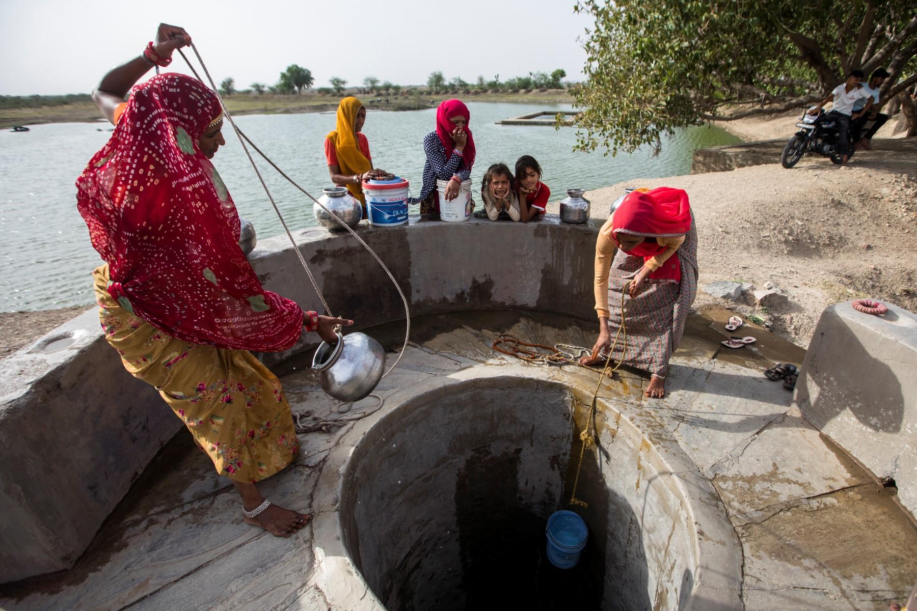 Women collect water from a well in Chhapya village of India's Rajasthan state on May 31. Photo: AFP
