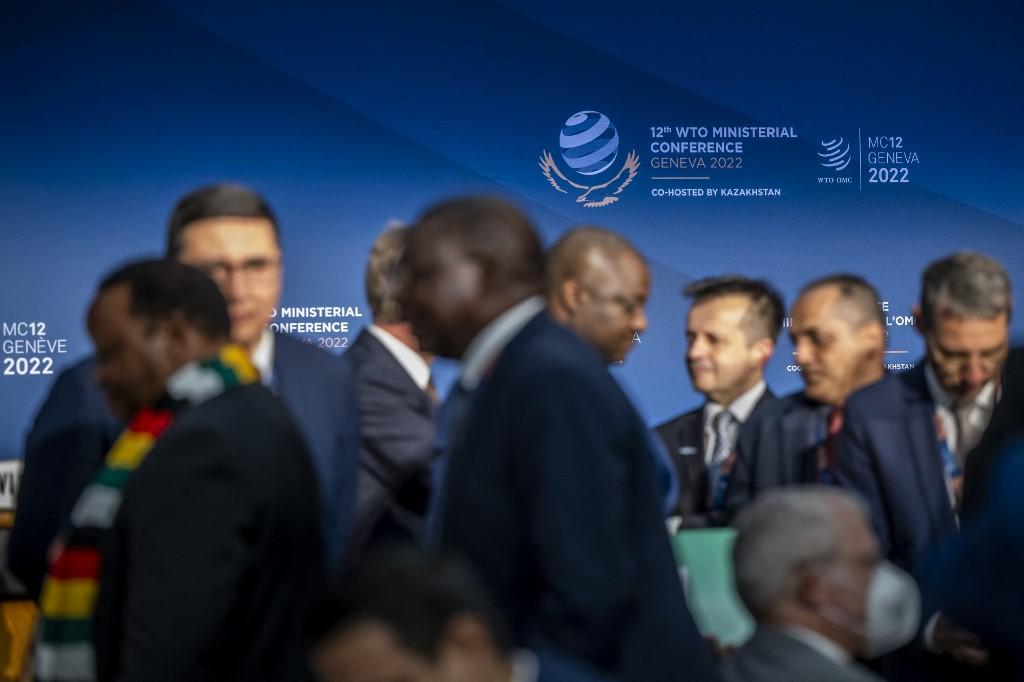 Ambassadors discuss before the opening ceremony of the 12th ministerial conference at the headquarters of the World Trade Organization in Geneva, on June 12. Photo: AFP