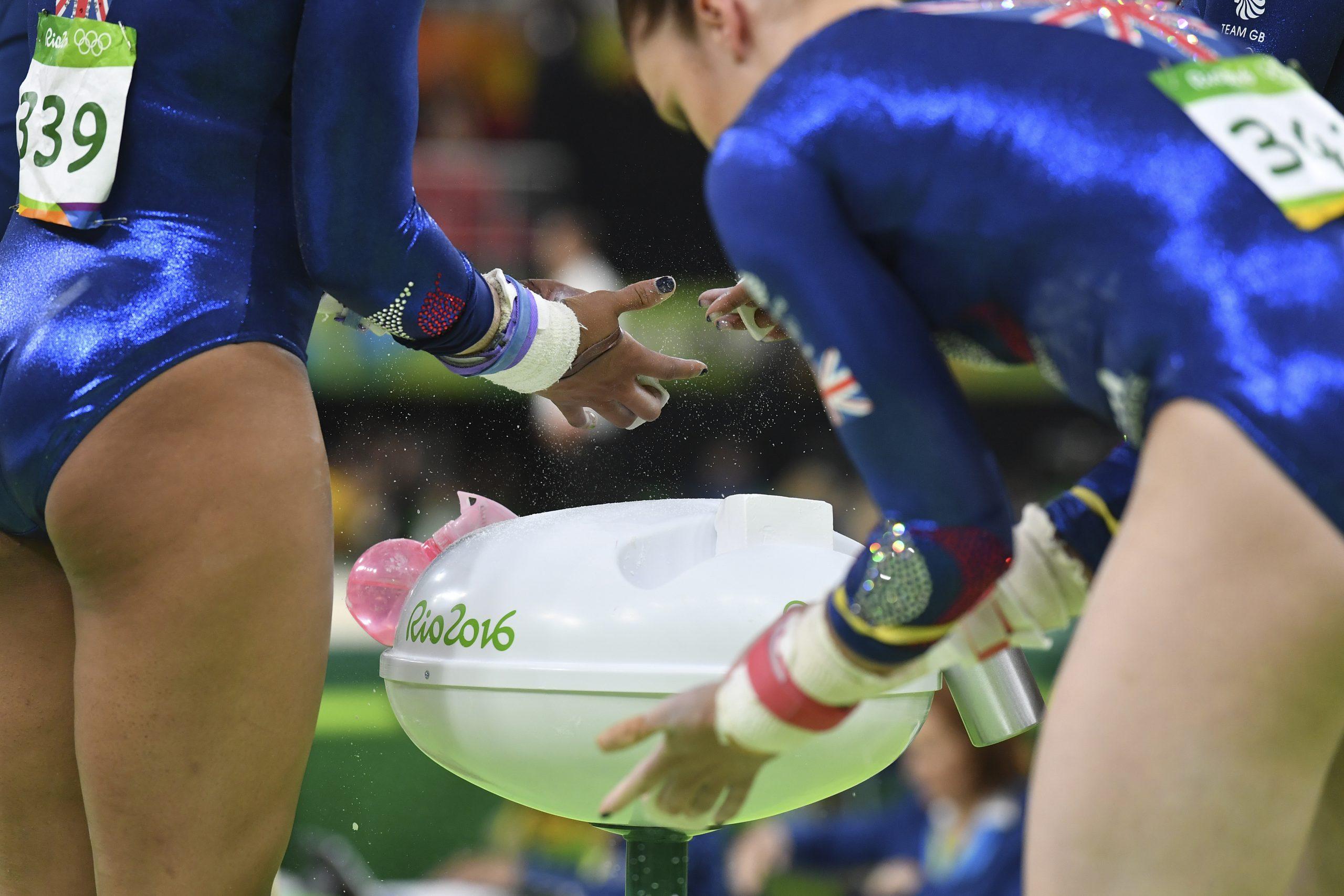 British gymnasts prepare with chalk during the qualifying for the women's Artistic Gymnastics at the Olympic Arena during the Rio 2016 Olympic Games in Rio de Janeiro on Aug 7, 2016. Photo: AFP