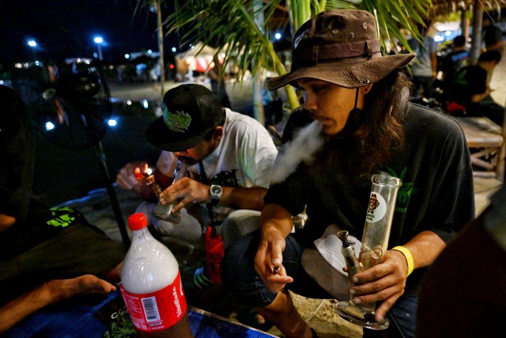 People smoke weed to celebrate the legalisation of cannabis at the 'Thailand: 420 Legalaew!' weekend festival hosted by Highland in Nakhon Pathom province on June 11. Photo: AFP