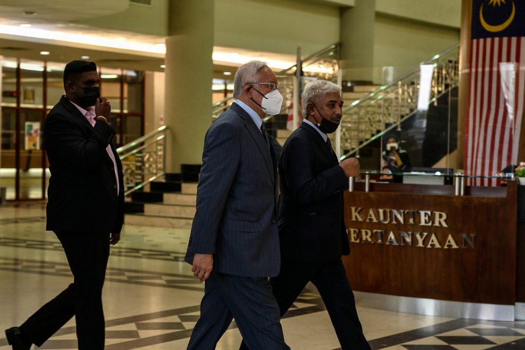 Former prime minister Najib Razak (centre) arrives at the Kuala Lumpur court complex today. Photo: Bernama