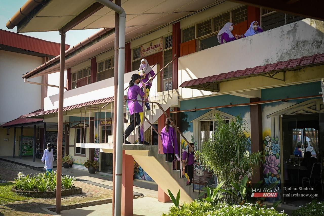 Students head to the canteen at recess time at SMK (P) Sri Aman in Petaling Jaya, Selangor.