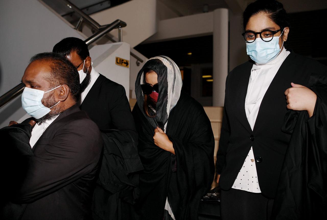 Samirah Muzaffar (second right), the widow of Cradle Fund CEO Nazrin Hassan, leaves the Shah Alam High Court today. Photo: Bernama