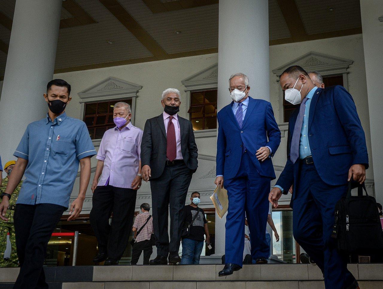 Former prime minister Najib Razak (second right) leaves the Kuala Lumpur court complex today. Photo: Bernama