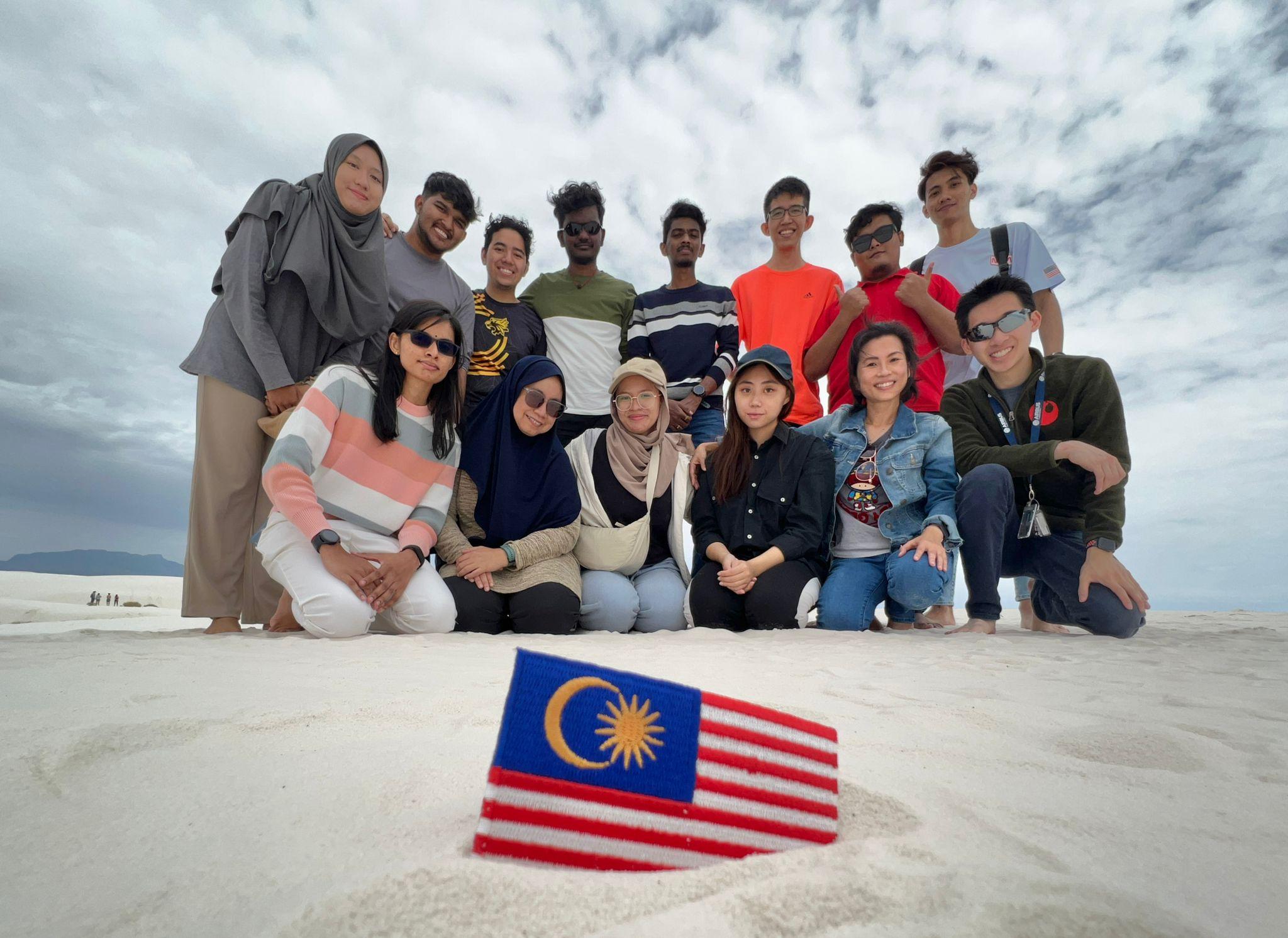Wau Rocketry team members pose for a shot at the White Sand National Monument after their arrival in the US.