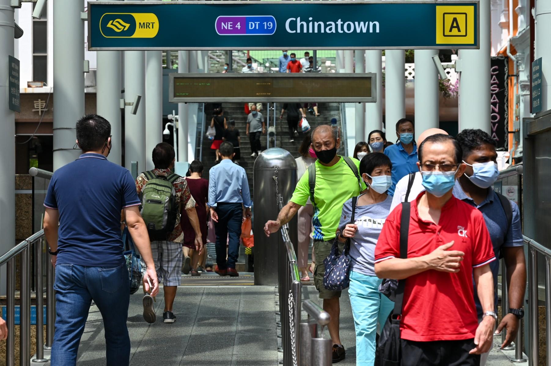 People walk in and out of the MRT subway station at the Chinatown district in Singapore on Jan 10. Photo: AFP
