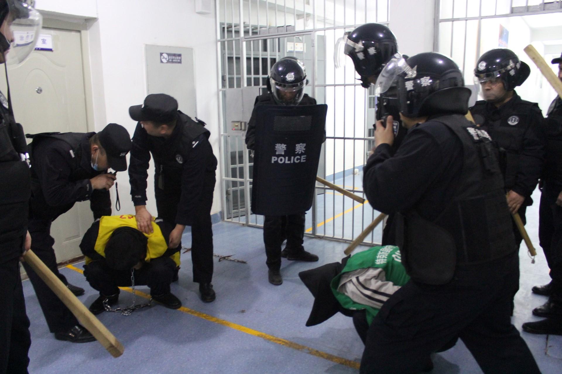 This undated handout image released by The Victims of Communism Memorial Foundation on May 24, shows SWAT team personnel engaged in an apparent anti-escape or anti-riot drill at the Tekes County Detention Centre in the Xinjiang Region of western China in February 2018. Photo: AFP