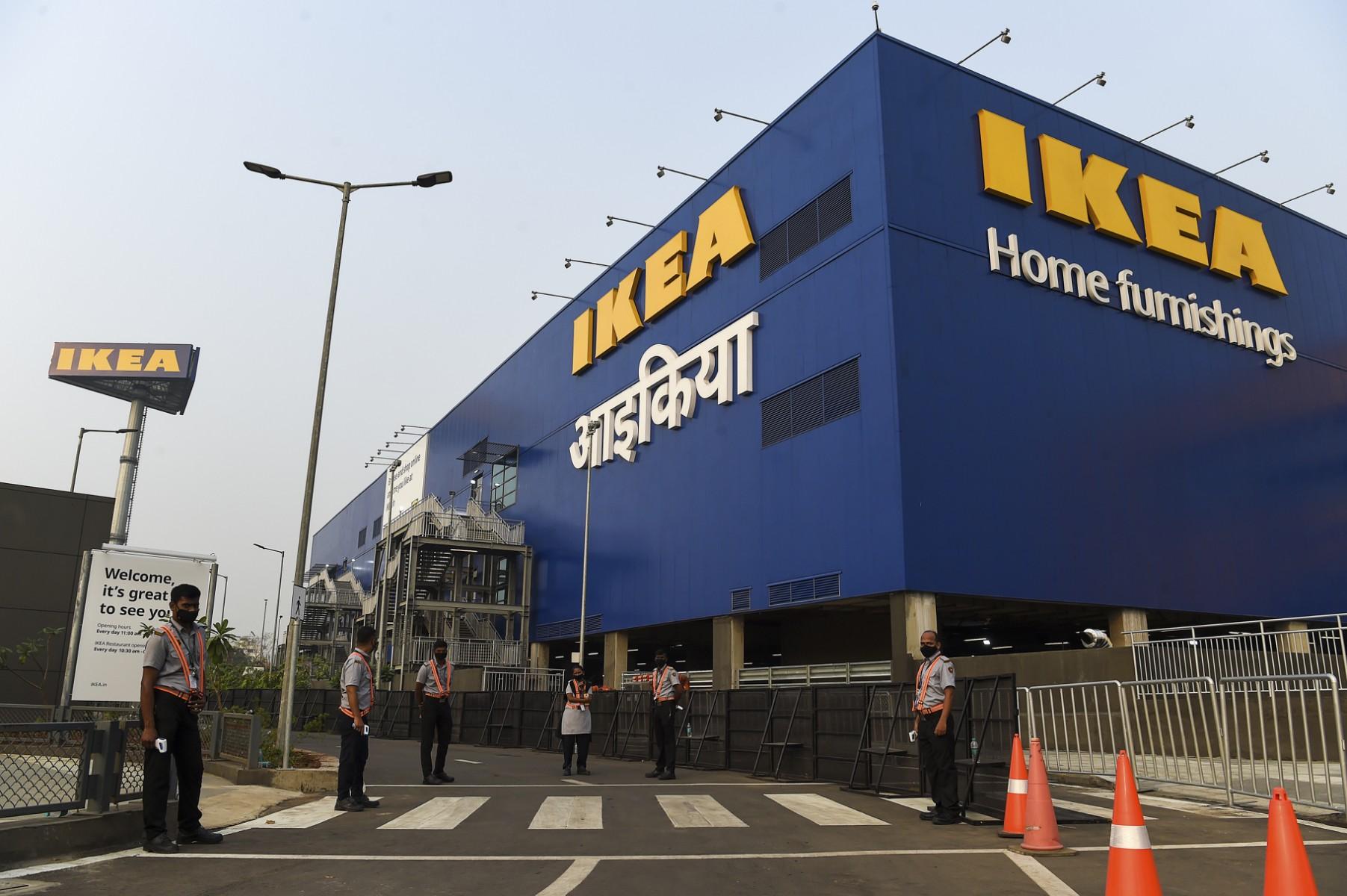 Security personnel stand guard at the entrance of new IKEA store in Navi Mumbai on December 17, 2020. Photo: AFP