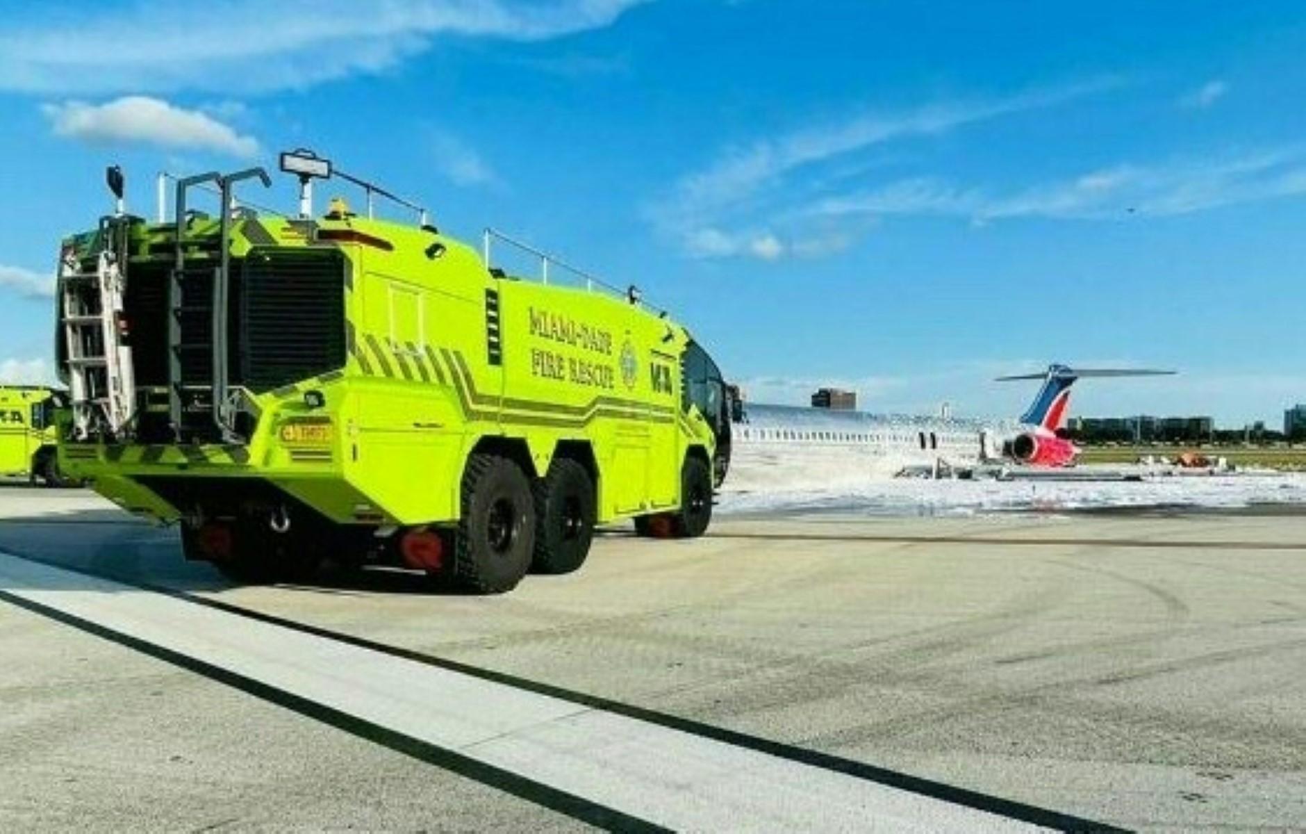 A handout picture provided by the Miami-Dade Fire Rescue shows a Red Air jet after catching fire while landing at Miami International Airport on June 22 in Miami, Florida. Photo: AFP