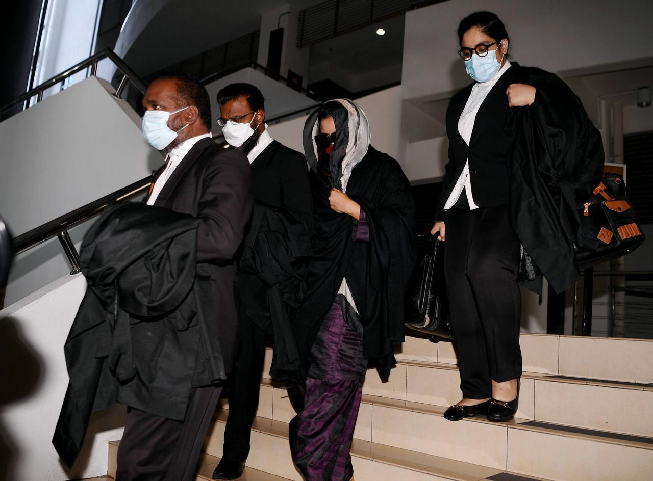 Samirah Muzaffar (second right), the widow of Cradle Fund CEO Nazrin Hassan, leaves the Shah Alam High Court after being acquitted of his murder on June 21. Photo: Bernama