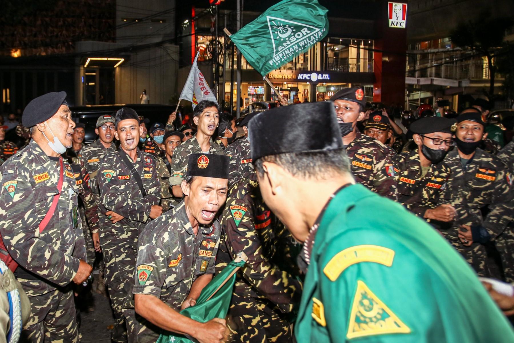 This picture taken on June 24 shows members of an Islamic organisation holding a protest in front of the Holywings bar in Jakarta. Indonesian police arrested six people on charges of blasphemy over the bar chain's free alcohol promotion for patrons named Mohammed. Photo: AFP