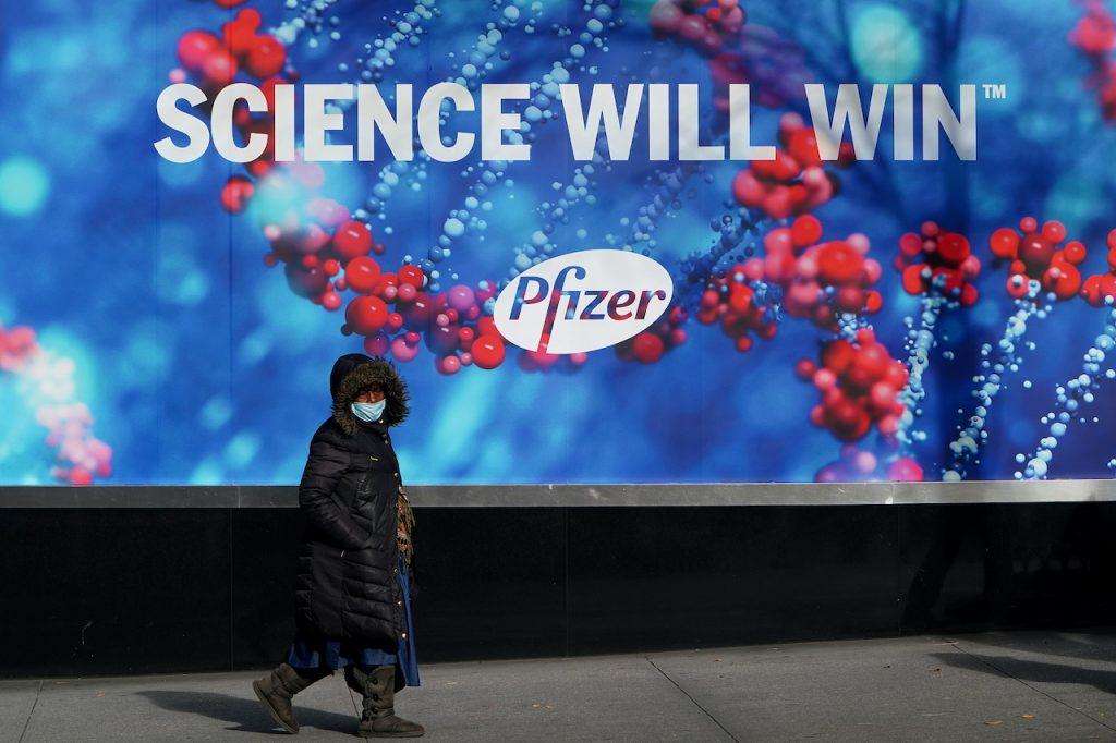 A pedestrian walks past the Pfizer headquarters building in the Manhattan borough of New York City, New York, Dec 7, 2020. Photo: Reuters