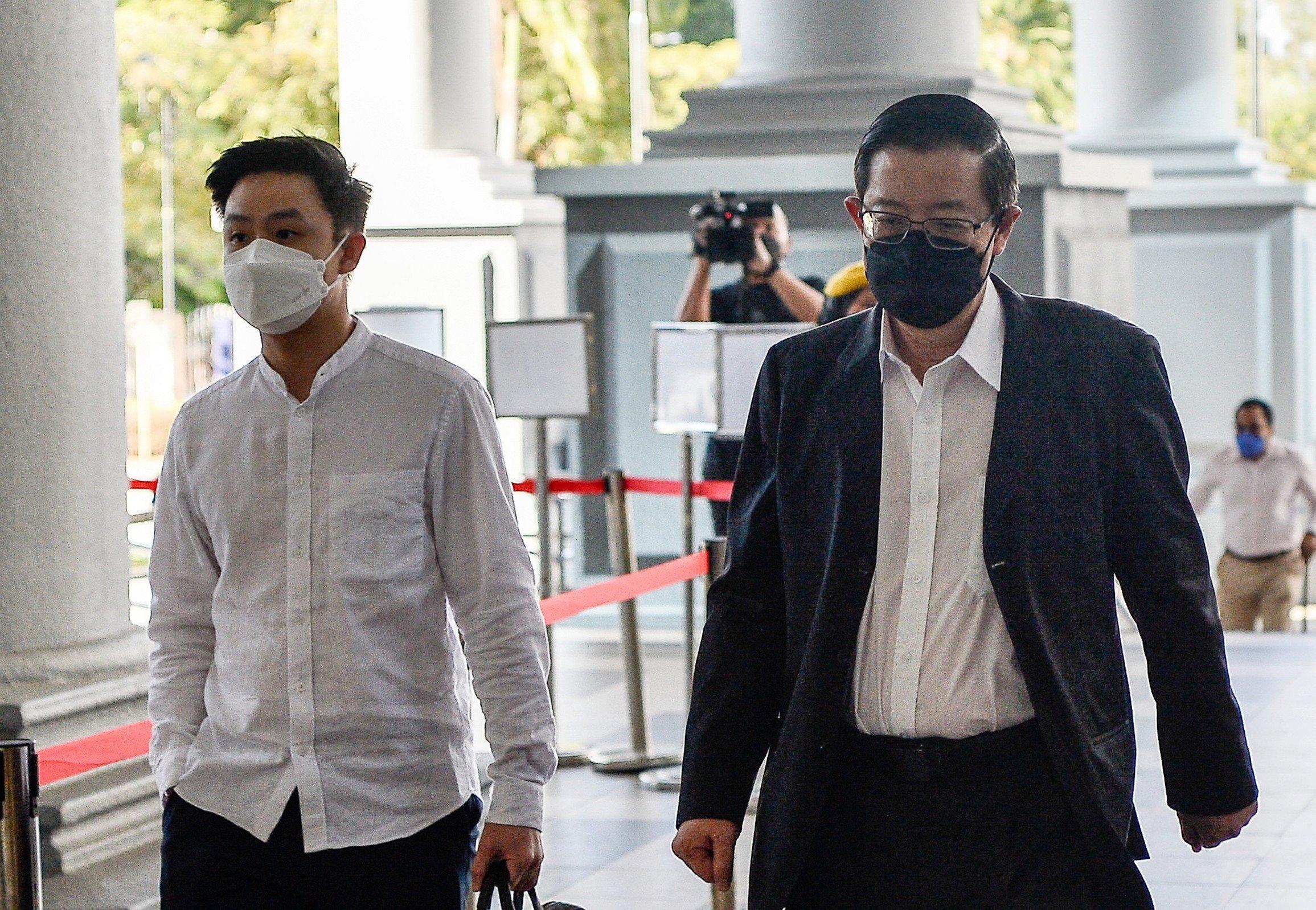 Former Penang chief minister Lim Guan Eng (right) arrives at the Kuala Lumpur court complex today. Photo: Bernama