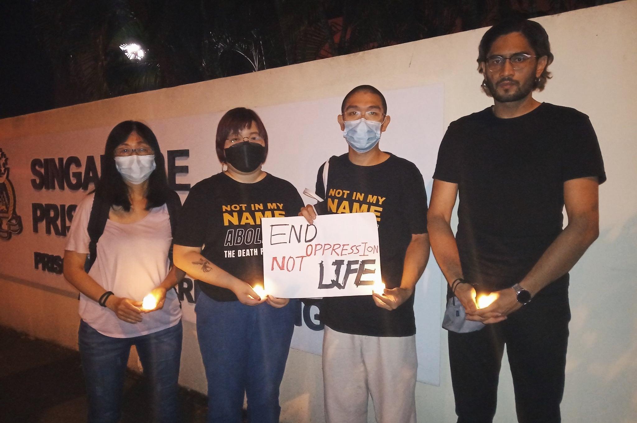Activists Kirsten Han and Rocky Howe (centre) take part in a peaceful, four-person vigil outside Singapore's Changi prison on April 25. The photo later sparked a police investigation into possible offences under the Public Order Act. Photo: Facebook