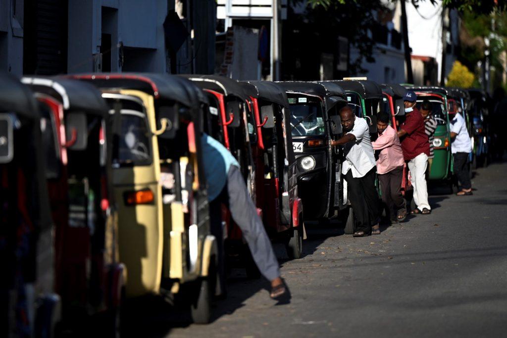Three-wheeler vehicles queue to fill their tanks up at a Ceylon Petroleum Corporation fuel station in Colombo on April 15. Photo: AFP