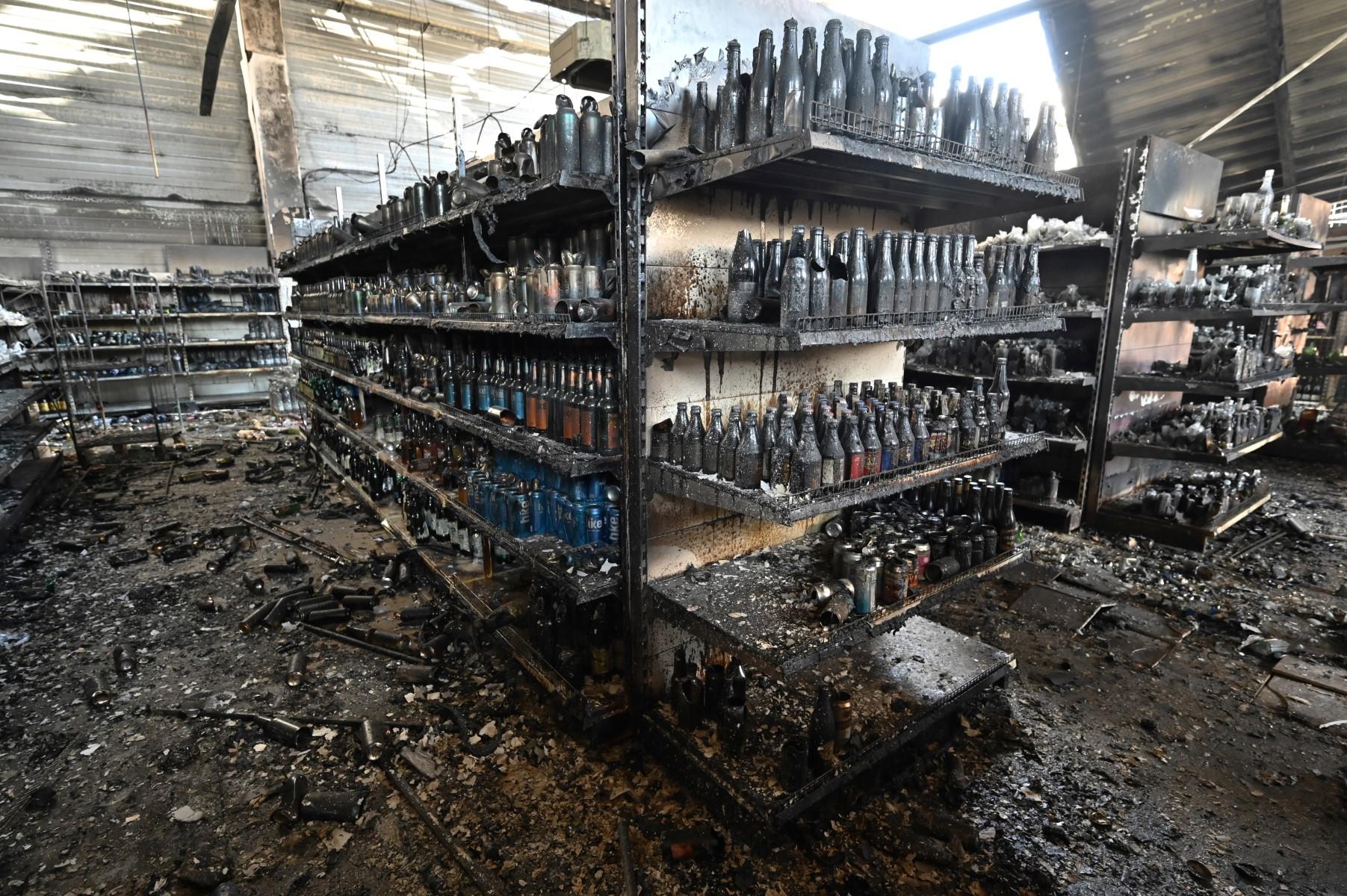 A photograph taken on June 28, shows charred goods in a grocery store of the destroyed Amstor mall in Kremenchuk, one day after it was hit by a Russian missile strike according to Ukrainian authorities. Photo: AFP