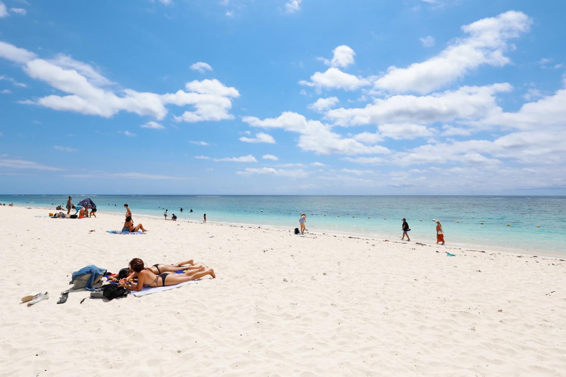 A general view of tourists on the Flic en Flac beach located on the western coast of Mauritius on Nov 3, 2021. Photo: AFP