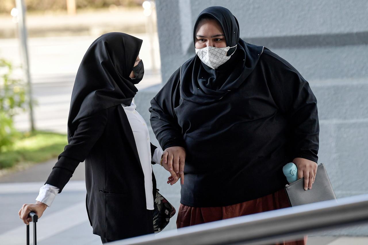 Rumah Bonda founder Siti Bainun Ahd Razali (right) at the Kuala Lumpur court complex yesterday. Photo: Bernama