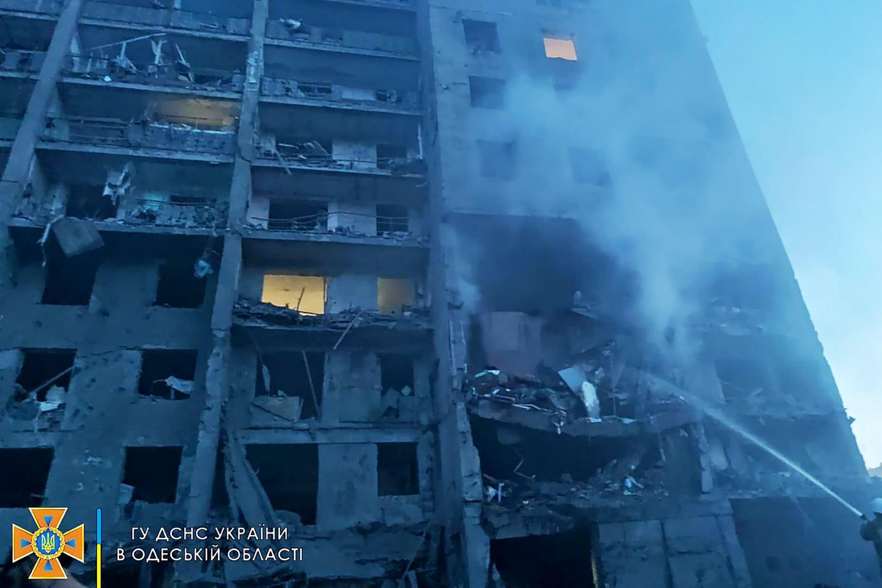 This handout picture taken and released by the Ukraine's State Emergency Service on July 1 shows a firefighter putting out the fire in a residents building hit by a missile strike in Ukrainian district of Bilhorod-Dnistrovskyi outside Odessa. Photo: AFP