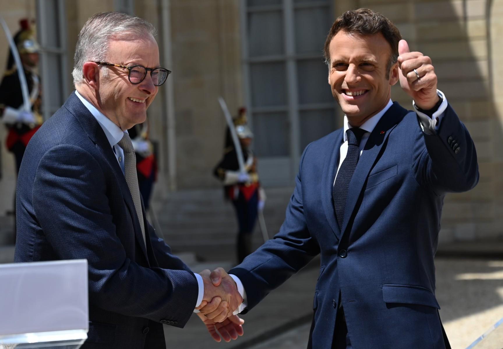 Australia's Prime Minister Anthony Albanese (left) and France's President Emmanuel Macron shake hands as they speak to the press prior to a working lunch at the presidential Elysee Palace in Paris on July 1. Photo: AFP
