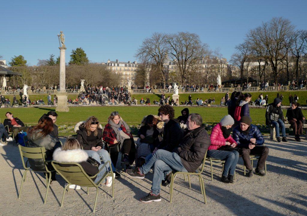 People gather as the sun shines in the Luxembourg Gardens in Paris on Feb 27. Photo: AFP
