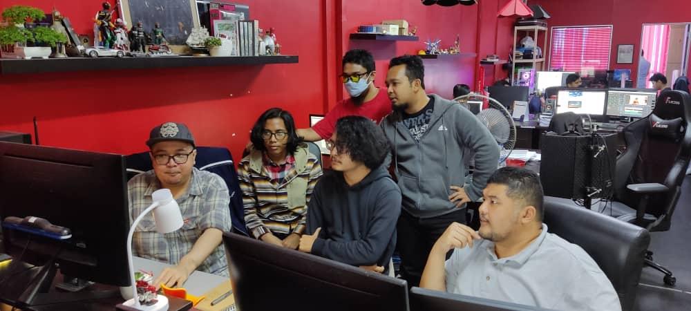 The production team holds a discussion to review the work by the animators at the Red Circle office in Kajang, Selangor.