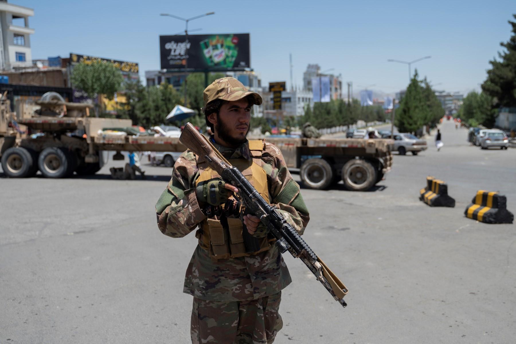 A Taliban fighter stands guard along a blocked street ahead of the council meeting of tribal and religious leaders in Kabul on June 29. Photo: AFP