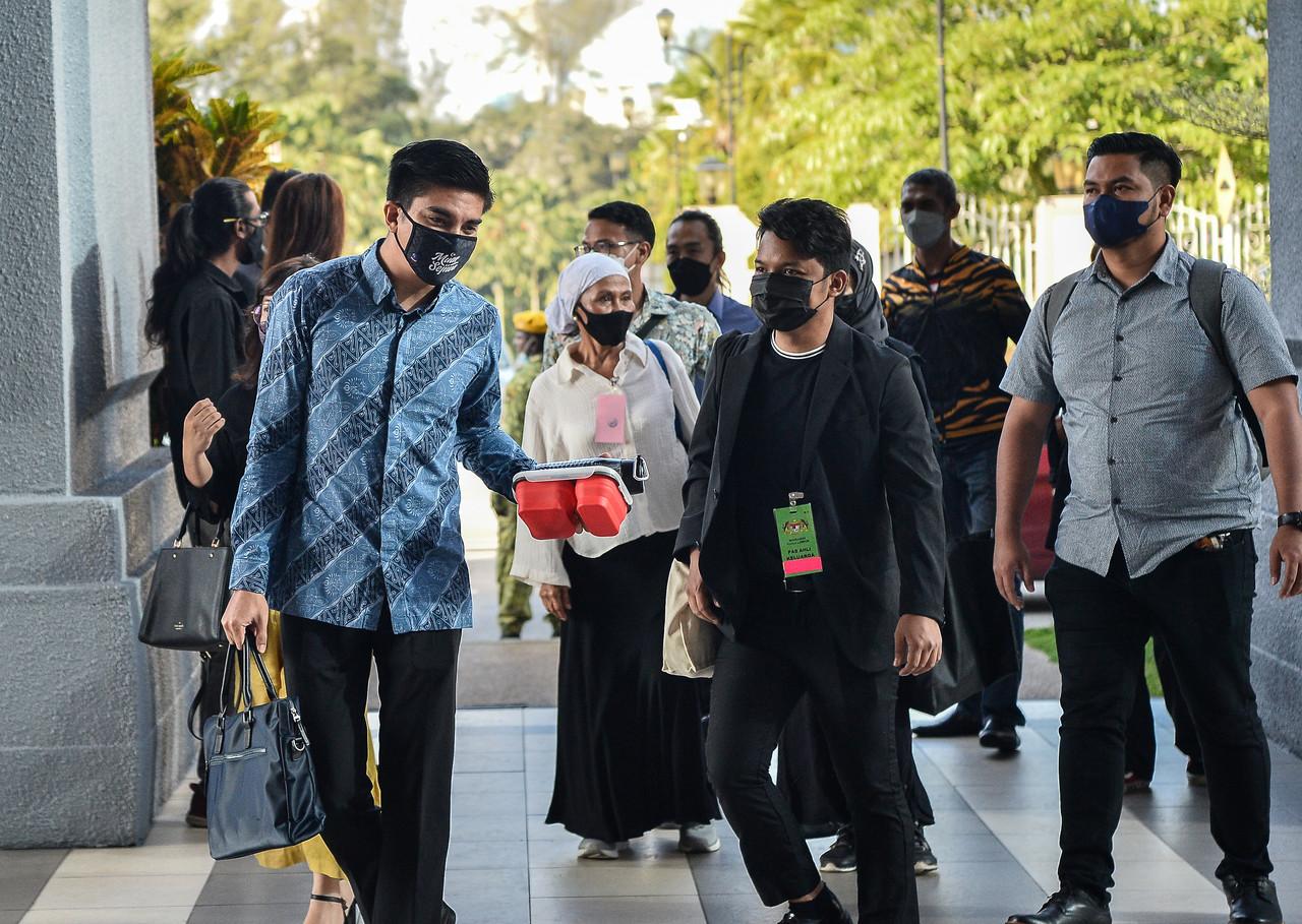 Muar MP Saddiq Syed Abdul Rahman (left) arrives at the Kuala Lumpur court complex yesterday. Photo: Bernama