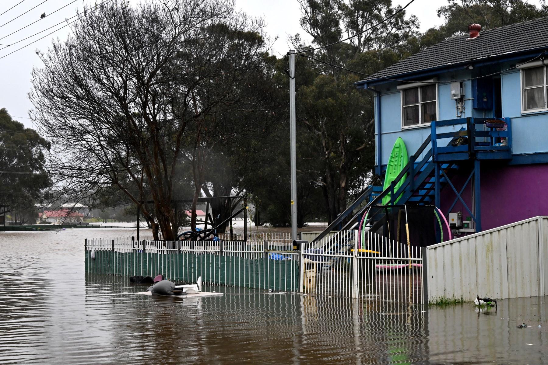 A general view shows a flooded residential area from the overflowing Hawkesbury river due to torrential rain in the Windsor suburb of Sydney on July 4. Photo: AFP